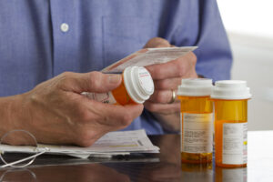 Man taking notes of controlled medications